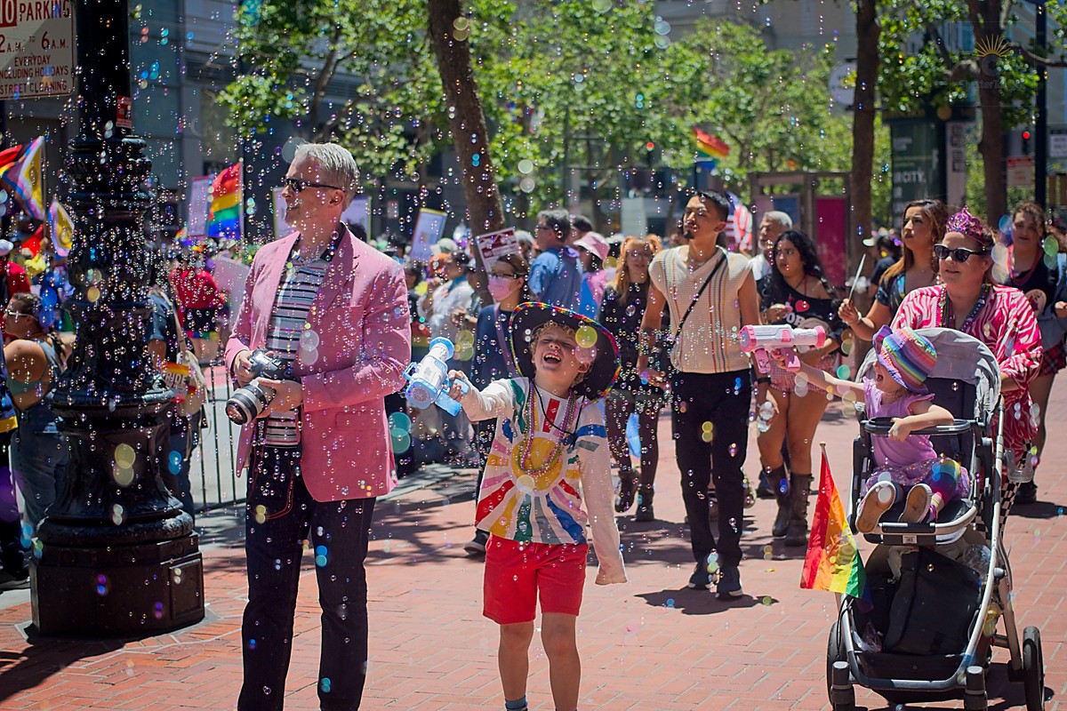 Kids with bubbles at Pride parade